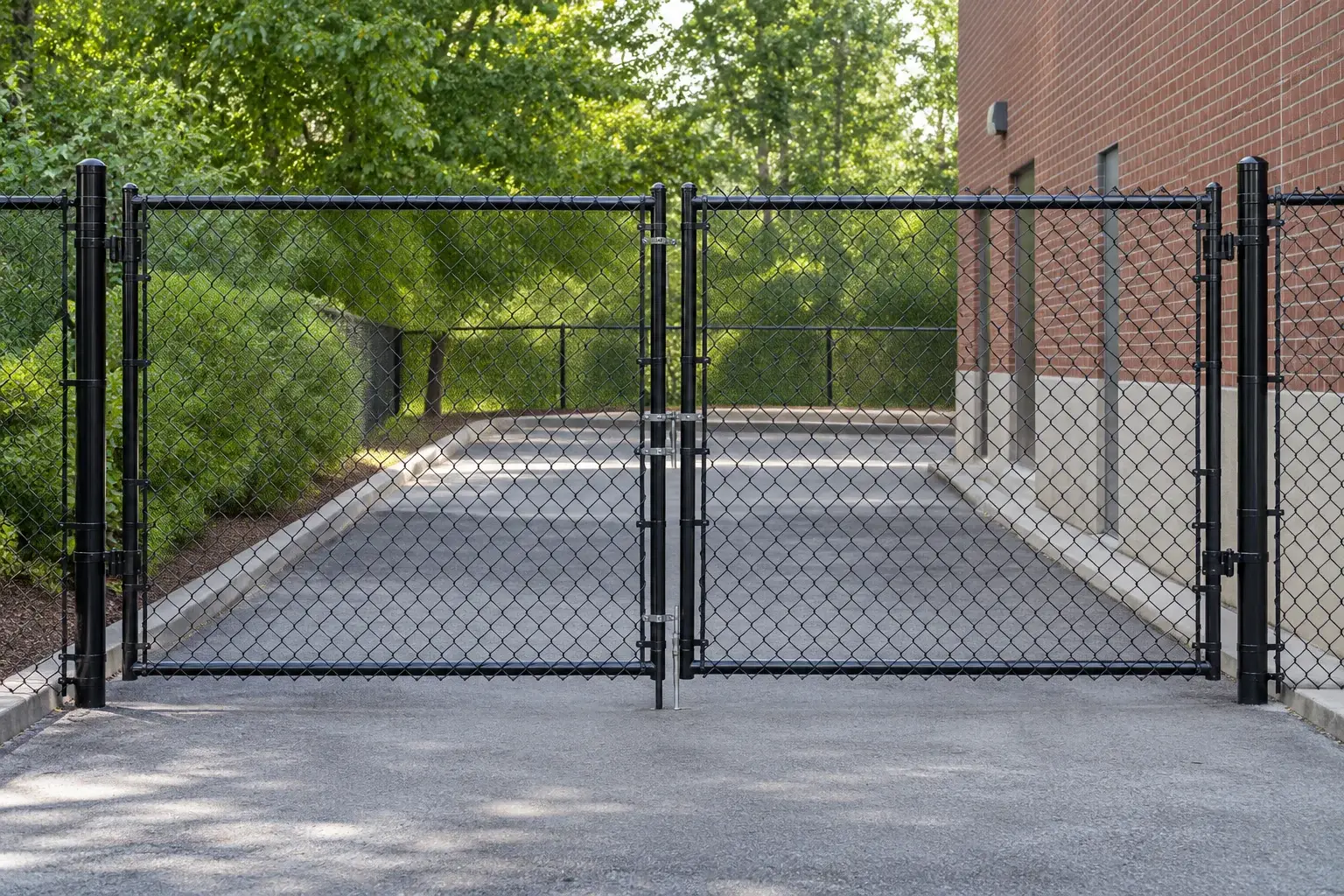 Black coated chain-link fence and gate with steel framework